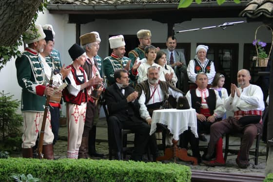 A re-enactment of a committee meeting in the museum courtyard
