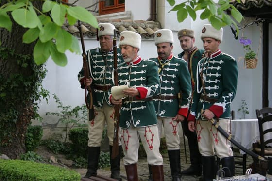 An insurgent re-enactment in front of the National Revival house